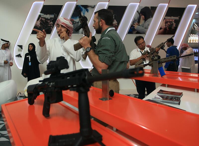 ABU DHABI - UNITED ARAB EMIRATES - 21FEB2013 -  A visitor takes a look CAR 816 riffle at Caracal pavillion at International Defence Exhibition and Conference, IDEX 2013 on the last day yesterday at Abu Dhabi National Exhibition Centre. Ravindranath K / The National