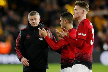 Manchester United interim manager Ole Gunnar Solskjaer looks dejected after the 2-0 FA Cup defeat to Wolves with Scott McTominay and Andreas Pereira. Reuters