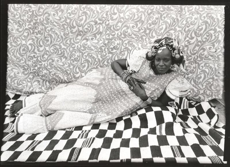 Seydou Keïta's Reclining Woman is part of the photography exhibition at The Metropolitan Museum of Art. Keïta / SKPEAC