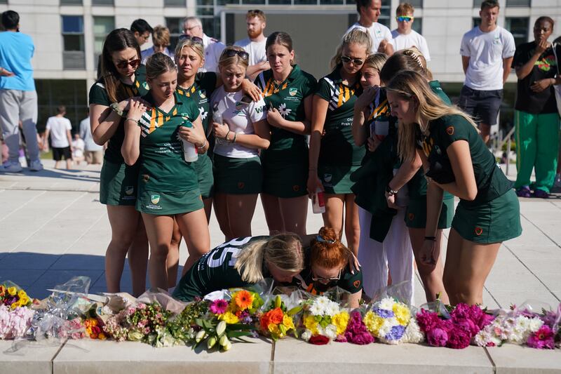 Team mates of Grace O'Malley Kumar lay flowers at the university. PA