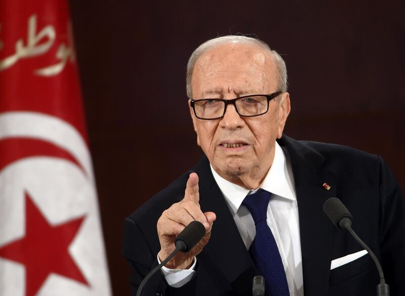 (FILES) In this file photo taken on March 20, 2015, Tunisian President Beji Caid Essebsi delivers a speech during a ceremony marking the 59th anniversary of Tunisia's independence at the Carthage palace in Tunis. Tunisia is not threatened by any power vacuum as President Beji Caid Essebsi remains in hospital after being taken ill, one of his advisors said on June 28, 2019 adding the veteran leader was in stable condition. / AFP / Fethi Belaid
