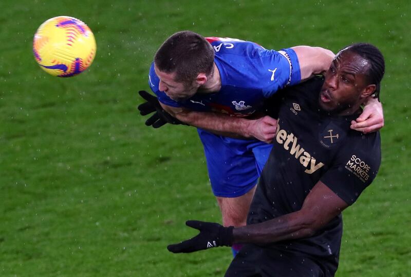 Crystal Palace's English defender Gary Cahill vies with West Ham United's English midfielder Michail Antonio. AFP