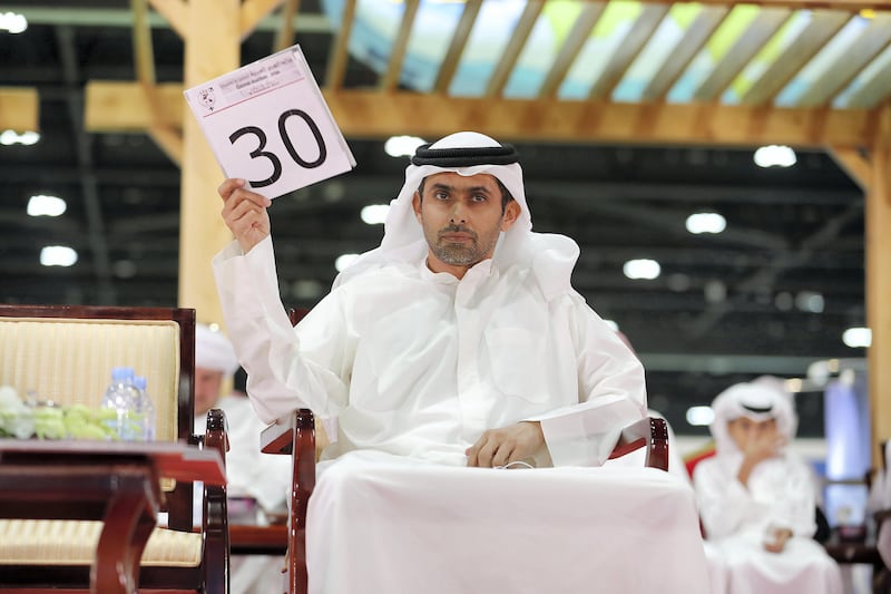ABU DHABI , UNITED ARAB EMIRATES , SEP 15  ��� 2017 : Hamad Salem highest bidder during the camel auction in the ADIHEX 2017 held at  Abu Dhabi National Exhibition Centre in Abu Dhabi. ( Pawan Singh / The National ) Story by Anna