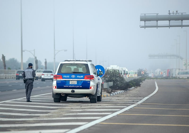 Abu Dhabi, United Arab Emirates, March 4, 2021.  Foggy morning at Abu Dhabi.  A police officer makes sure traffic goes smoothly during a foggy morning along the E10 Highway.
Victor Besa / The National
Section:  NA