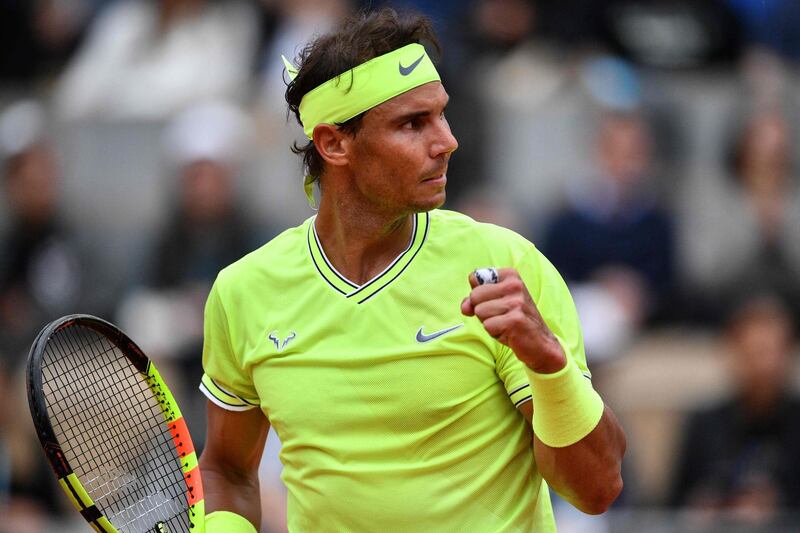 Nadal reacts after winning a point against Thiem. AFP