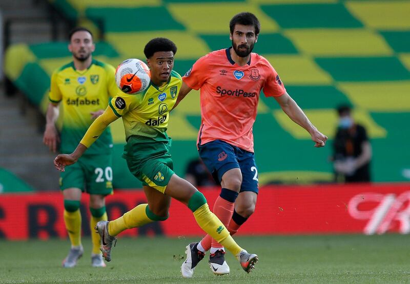 Everton's Andre Gomes is challenged by Jamal Lewis of Norwich. AP