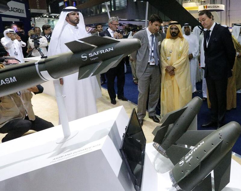 Sheikh Mohammed bin Rashid, Vice President of the UAE and Ruler of Dubai, visits the Sagem stand at Idex. Displayed on the stand in an air-to-ground modular weapon (AASM) hammer by Safran. AFP

