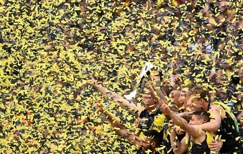 The Tigers celebrate with the Premiership  Trophy during the 2019 AFL Grand Final match between the Richmond Tigers and the Greater Western Sydney Giants at Melbourne Cricket Ground  in Melbourne, Australia.  Getty
