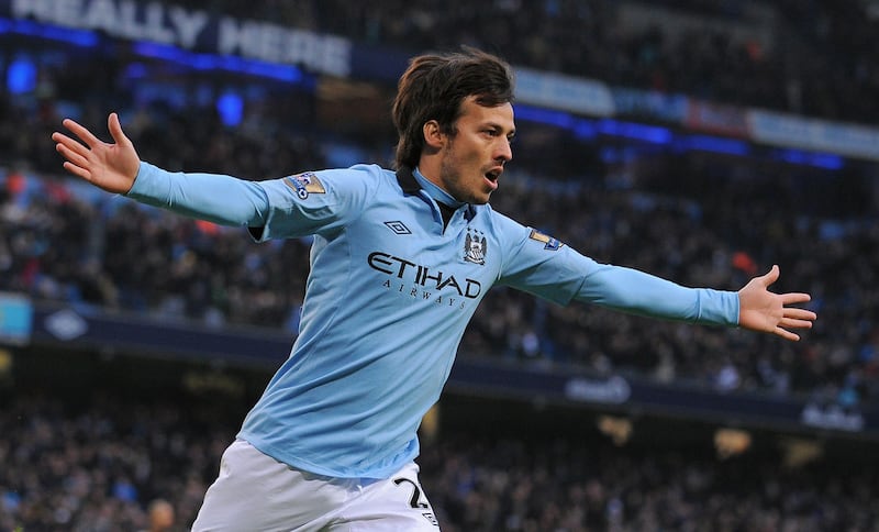 Manchester City's Spanish midfielder David Silva celebrates after scoring the opening goal during their English Premier League football match at the Etihad Stadium in Manchester on January 19, 2013.  AFP PHOTO/Andrew YATES - RESTRICTED TO EDITORIAL USE. No use with unauthorized audio, video, data, fixture lists, club/league logos or “live” services. Online in-match use limited to 45 images, no video emulation. No use in betting, games or single club/league/player publications.
 *** Local Caption ***  295243-01-08.jpg