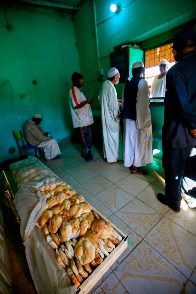 Sudanese people buy bread at a bakery in the town of Atbara, an industrial town 350 kilometres northeast of Sudan’s capital Khartoum. AFP