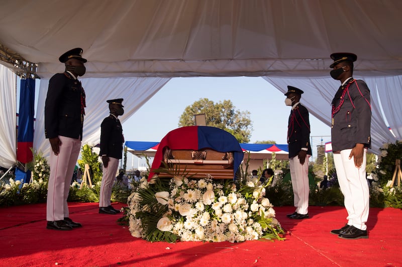 Police officers stand guard over the coffin of Haiti's assassinated president Jovenel Moise, at his funeral in Cap-Haitien. EPA