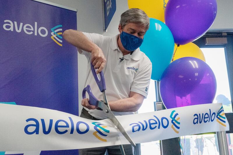 Andrew Levy, chief executive officer of Avelo Airlines, cuts a ceremonial ribbon ahead of the airline's inaugural flight. New money is flowing to low-cost airlines in the US as they take on giant carriers racing to recover from the unprecedented collapse in travel during the pandemic. Bloomberg