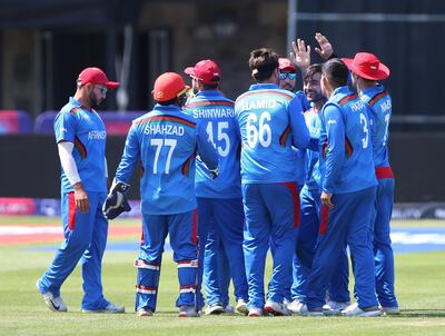 Afghanistan's players celebrate after taking the wicket of Pakistan's Mohammad Hafeez during the ICC Cricket World Cup Warm up match at The Bristol County Ground. PRESS ASSOCIATION Photo. Picture date: Friday May 24, 2019. See PA story CRICKET Pakistan. Photo credit should read: Nigel French/PA Wire. RESTRICTIONS: Editorial use only. No commercial use. Still image use only.