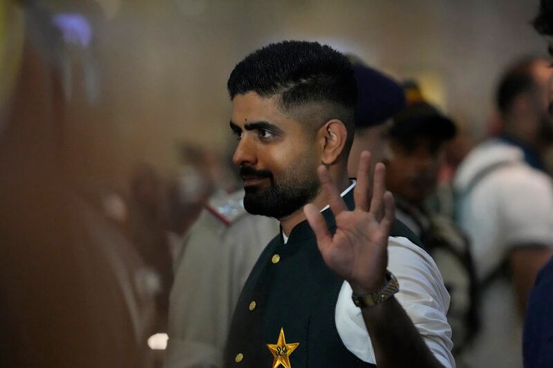 Pakistan's cricket captain Babar Azam waves after arriving in Hyderabad. AP