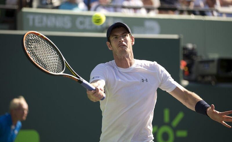 Andy Murray, of Great Britain, returns the ball to Kevin Anderson, of South Africa, during their match at the Miami Open tennis tournament in Key Biscayne, Fla., Tuesday, March 31, 2015. (AP Photo/J Pat Carter)