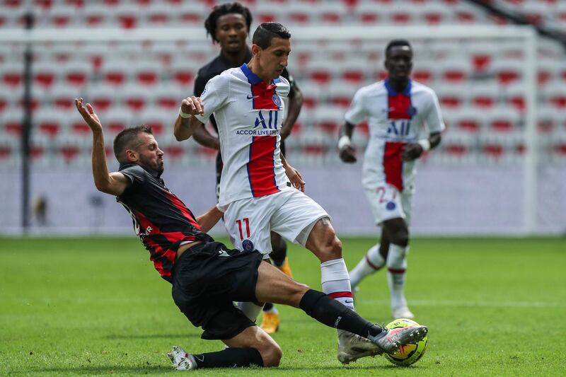 Nice's Morgan Schneiderlin, tackles Angel Di Maria of PSG. AP