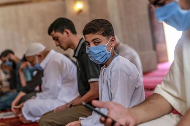 Palestinians wearing protective face masks attend Fraiday prayers as mosques reopen amid the ongoing coronavirus Covid-19 pandemic in Gaza City, Gaza Strip, 22 May 2020. EPA