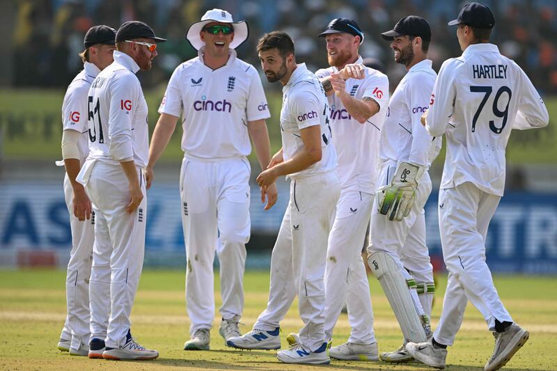 England's Mark Wood, centre, was the pick of the bowlers with three wickets. AFP