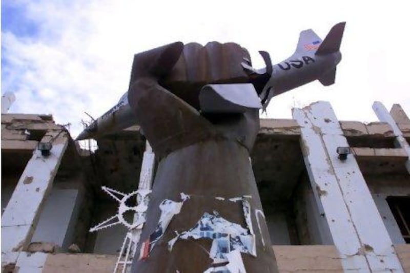 A monument featuring a clenched fist crushing a US fighter aircraft is seen outside the former residence of Libyan leader Muammar Qaddafi. VP