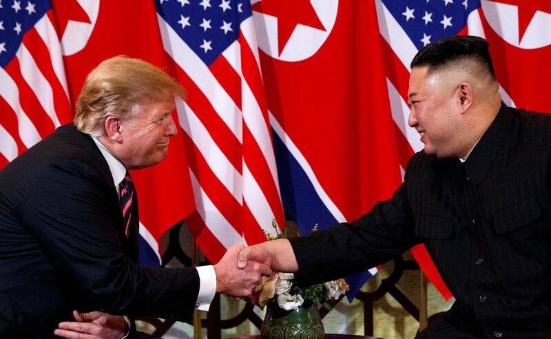 FILE - In this Wednesday, Feb. 27, 2019, file photo, U.S. President Donald Trump shakes hands with North Korean leader Kim Jong Un in Hanoi. Trump said he walked away from his second summit with North Korean leader Kim Jong Un because Kim demanded the U.S. lift all of its sanctions, a claim that North Korea's delegation called a rare news conference in the middle of the night to deny. (AP Photo/ Evan Vucci, File)