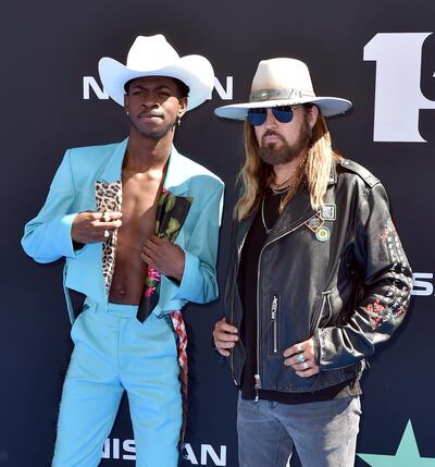 LOS ANGELES, CALIFORNIA - JUNE 23: (L-R) Lil Nas X and Billy Ray Cyrus attend the 2019 BET Awards on June 23, 2019 in Los Angeles, California.   Aaron J. Thornton/Getty Images for BET/AFP