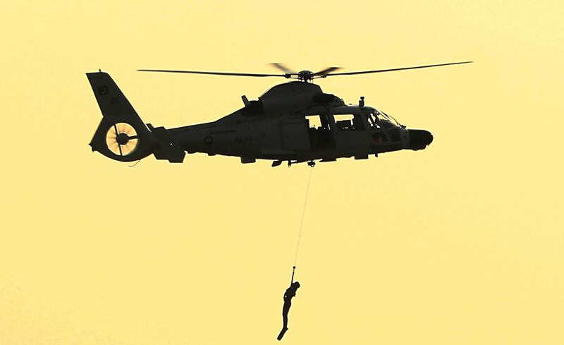 Pakistan Navy members during a demonstration at the exhibition. EPA