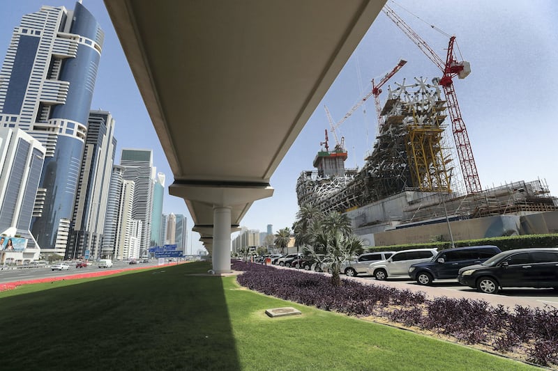 Dubai, UAE, April 1, 2018.  Facade of Museum of the Future.  Juxtaposition of the present and the future separated by thr Dubai Metro along Sheikh Zayed Road.
Victor Besa / The National
National
