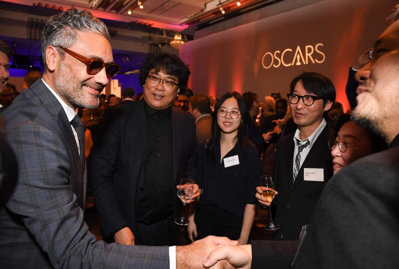 Director Taika Waititi meets fellow director Bong Joon-ho and his team during the 2020 Oscars Nominees Luncheon. AFP