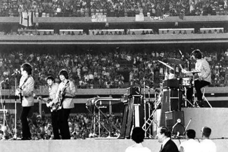 The Beatles performing at New York's Shea Stadium in 1965. An expected 50,000 Beatles fans are expected to visit Liverpool to celebrate the annual International Beatles Week. AP Photo