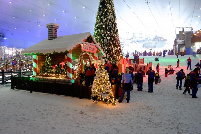 Santa’s wooden hut was popular with visitors at Ski Dubai on Christmas eve. Antonie Robertson / The National