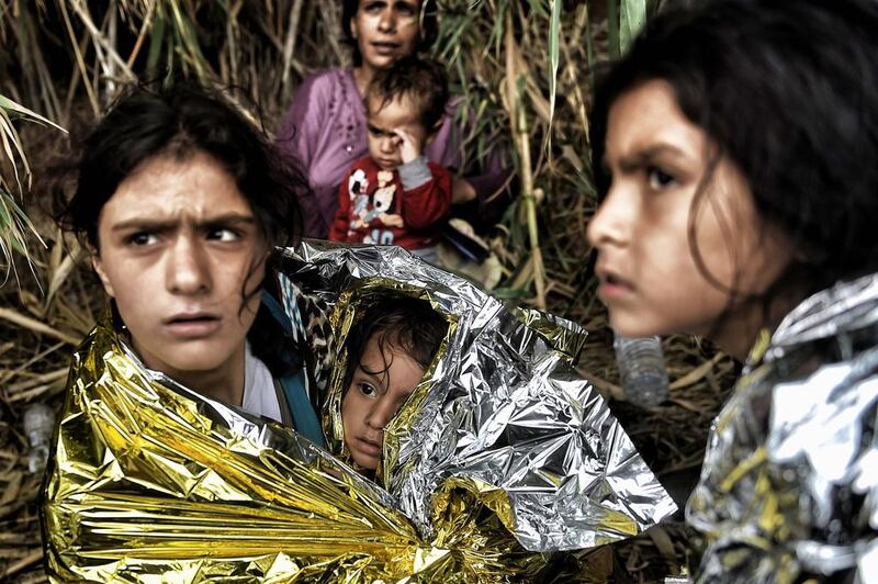 Syrian refugees on the Greek island of Lesbos.  Aris Messinis / AFP