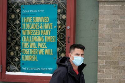 A man walks past the Egyptian Theatre Thursday, Jan. 28, 2021, in Park City, Utah. The largely virtual Sundance Film Festival opened Thursday. (AP Photo/Rick Bowmer)