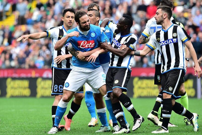 Napoli's Gonzalo Higuain reacts after he received a red card during the Italian Serie A football match Udinese vs Napoli at Friuli Stadium in Udine on April 3, 2016. / AFP / GIUSEPPE CACACE