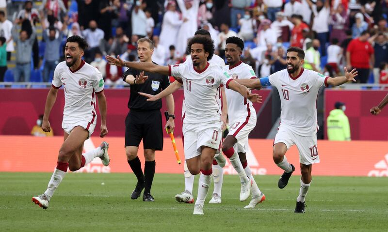 Qatar players celebrate after beating Egypt on penalties in the Fifa Arab Cup third-place play-off. Reuters