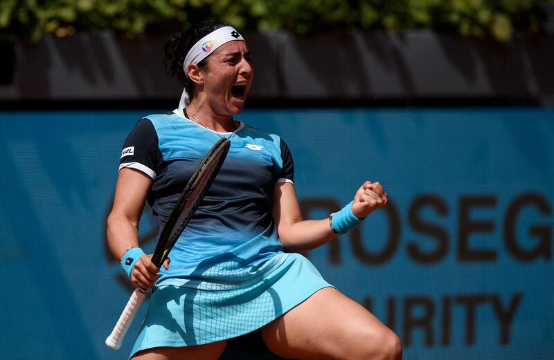 Ons Jabeur celebrates after defeating Romania's Simona Halep in the Madrid Open. AFP