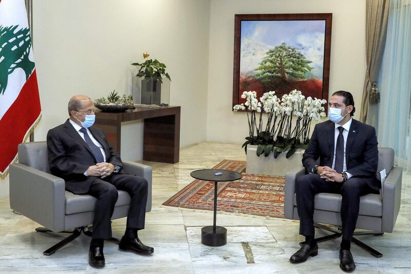 A handout picture provided by the Lebanese photo agency Dalati and Nohra on March 22, 2021, shows Lebanese President Michel Aoun (L) meeting with prime minister-designate Saad Hariri at the presidential palace in Baabda, east of the capital Beirut. === RESTRICTED TO EDITORIAL USE - MANDATORY CREDIT "AFP PHOTO / HO / DALATI AND NOHRA" - NO MARKETING - NO ADVERTISING CAMPAIGNS - DISTRIBUTED AS A SERVICE TO CLIENTS ===
 / AFP / DALATI AND NOHRA / - / === RESTRICTED TO EDITORIAL USE - MANDATORY CREDIT "AFP PHOTO / HO / DALATI AND NOHRA" - NO MARKETING - NO ADVERTISING CAMPAIGNS - DISTRIBUTED AS A SERVICE TO CLIENTS ===
