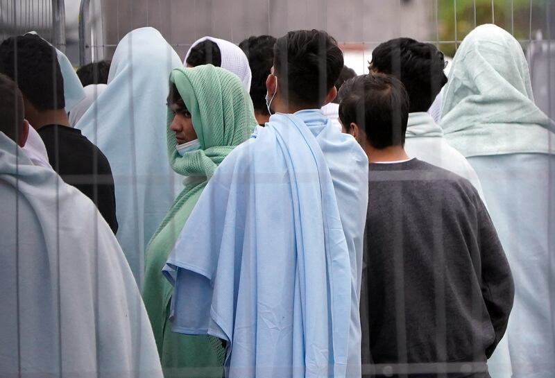 Migrants inside the Manston immigration centre in Thanet, Kent, England. PA