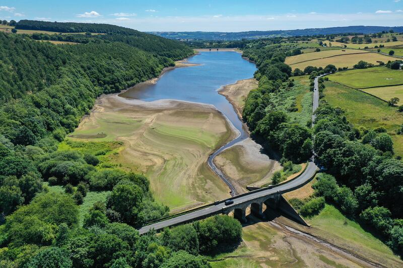 The drying-out bed and receded water levels at Lindley Wood Reservoir in Otley, northern England. Residential demand for water is high amid a summer heatwave. Getty Images