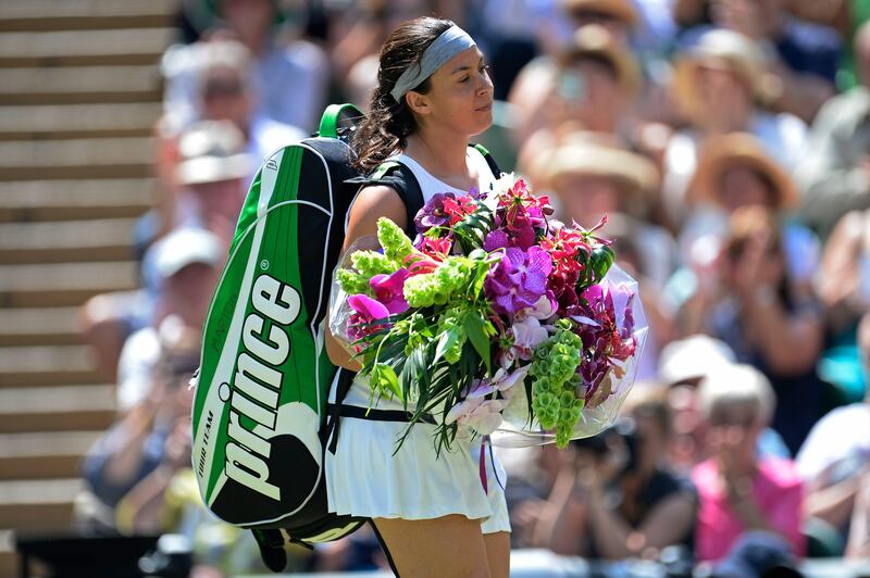 LONDON, ENGLAND - JULY 06:  Marion Bartoli of France arrives on Centre court for her Ladies' Singles final match against Sabine Lisicki of Germany on day twelve of the Wimbledon Lawn Tennis Championships at the All England Lawn Tennis and Croquet Club on July 6, 2013 in London, England.  (Photo by Dennis Grombkowski/Getty Images) *** Local Caption ***  173066815.jpg