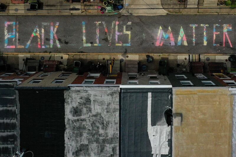 In an aerial image from a drone, a 'Black Lives Matter' mural chalk painting is seen on the 300 block of South Madeira Street in Baltimore, Maryland. Getty Images