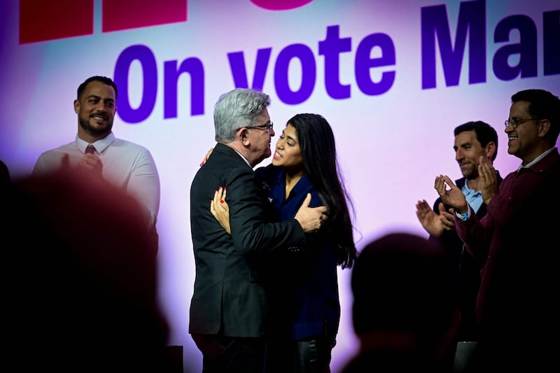 France Unbowed leader Jean-Luc Melenchon embraces candidate Rima Hassan, who vows to 'bring the Palestinian cause into the European Parliament'. AFP
