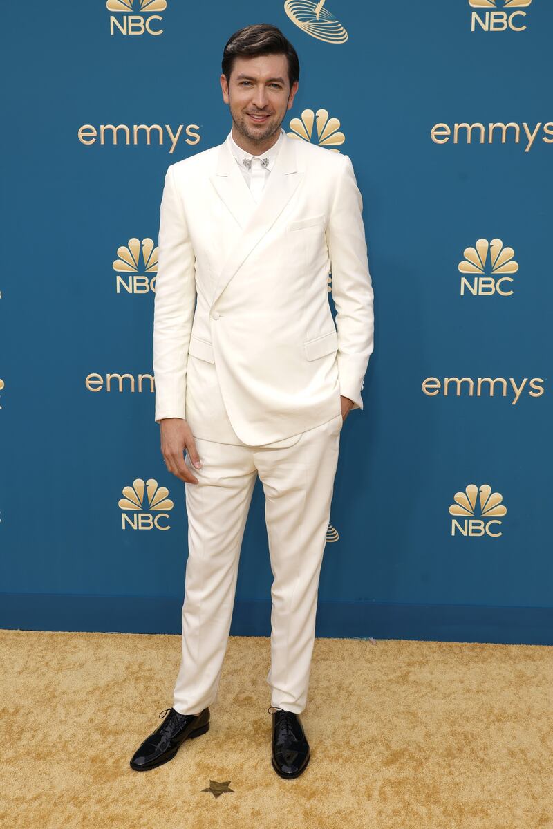 Nicholas Braun wearing a white Dior suit. Getty Images 