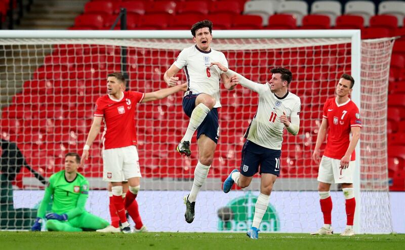 Soccer Football - World Cup Qualifiers Europe - Group I - England v Poland - Wembley Stadium, London, Britain - March 31, 2021 England's Harry Maguire celebrates scoring their second goal with Mason Mount Pool via REUTERS/Catherine Ivill     TPX IMAGES OF THE DAY