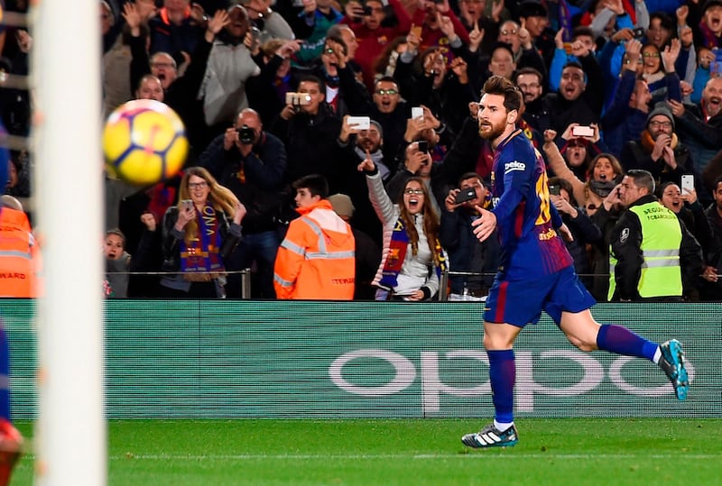 TOPSHOT - Barcelona's Argentinian forward Lionel Messi celebrates a goal during the Spanish league football match between FC Barcelona and Deportivo Alaves at the Camp Nou stadium in Barcelona on January 28, 2018. / AFP PHOTO / Josep LAGO