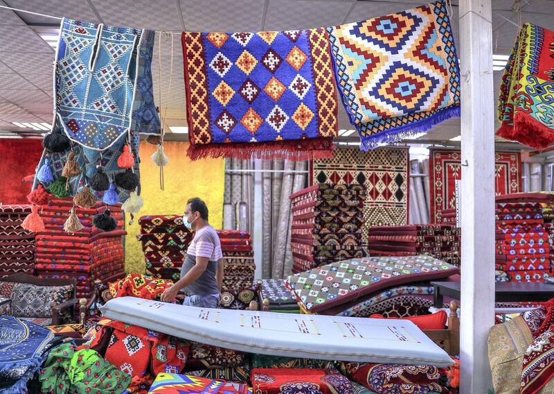 Abu Dhabi, United Arab Emirates, November 11, 2020.  Shop owners in Mina Zayed for a piece on how their shops will soon be demolished and replaced by new markets.  The Dar Al Ain pillows and mats section.
Victor Besa/The National
Section:  NA
Reporter:  Haneen Dajani