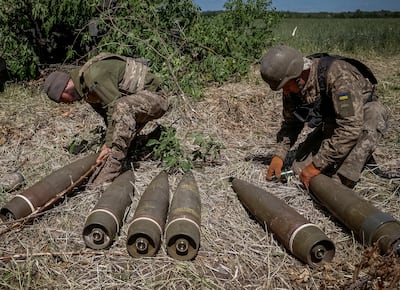 Ukrainian soldiers prepare shells for a M777 Howitzer near a frontline in Donetsk Region. Reuters