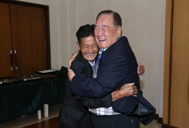 MOUNT KUMGANG, NORTH KOREA - AUGUST 20: (SOUTH KOREA OUT) South Korean Ham Sung-Chan, 93 (R) meets with his North Korean brother Ham Dong-Chan, 79 (L) during a separated family reunion meeting at the Mount Kumgang resort on August 20, 2018 in Mount Kumgang, North Korea. Almost a hundred South Koreans crossed the heavily armed border to meet their separated families for the first time since the 1950-53 Korean War, during a family reunion at North Korea. A total of 88 people from North Korea will also receive a chance to meet their families in the South during the six-day event which starts on August 20 at Mount Kumgang, north of the border between North and South Korea. (Photo O Jong-Chan-Korea Pool/Getty Images)