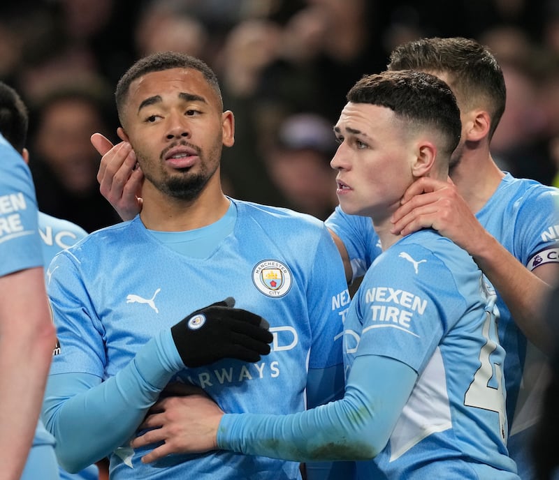 Phil Foden (R) of Manchester City celebrates with teammate Gabriel Jesus (L) after scoring the 1-0 lead during the English Premier League soccer match between Everton FC and Manchester City in Liverpool, Britain, 26 February 2022.   EPA/ANDREW YATES EDITORIAL USE ONLY.  No use with unauthorized audio, video, data, fixture lists, club/league logos or 'live' services.  Online in-match use limited to 120 images, no video emulation.  No use in betting, games or single club/league/player publications. 