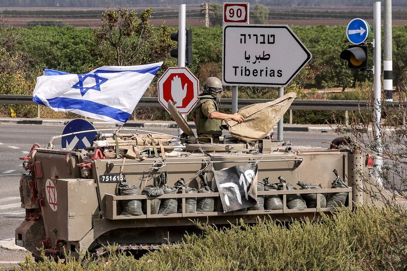 An Israeli medical vehicle moves along a road near the northern town of Kiryat Shmona. AFP