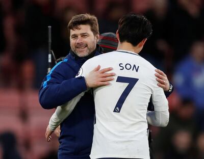 Soccer Football - Premier League - AFC Bournemouth vs Tottenham Hotspur - Vitality Stadium, Bournemouth, Britain - March 11, 2018   Tottenham manager Mauricio Pochettino celebrates after the match with Son Heung-min   Action Images via Reuters/Matthew Childs    EDITORIAL USE ONLY. No use with unauthorized audio, video, data, fixture lists, club/league logos or "live" services. Online in-match use limited to 75 images, no video emulation. No use in betting, games or single club/league/player publications.  Please contact your account representative for further details.